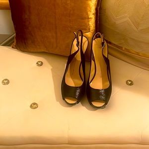 Size 9 black Giuseppe peep toe sandals.